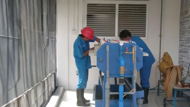 Mechanics working on a machine