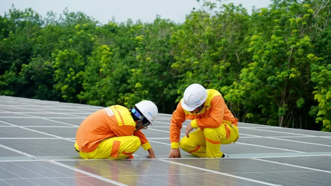 Men installing solar panels